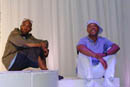 Mos Def and Russell Simmons sitting casually at Rush4Life