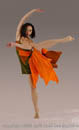 Young female dancer in brillant orange costume