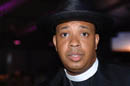 Rev. Run at Rush4Life in black hat and clerical collar