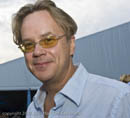 Tim Robbins in blue shirt and sunglasses