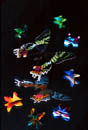 Butterflies and origami butterflies on black background